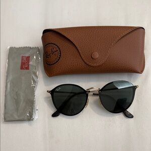 Ray-Ban Black Round Metal Sunglasses with Gold Accents RB3574N